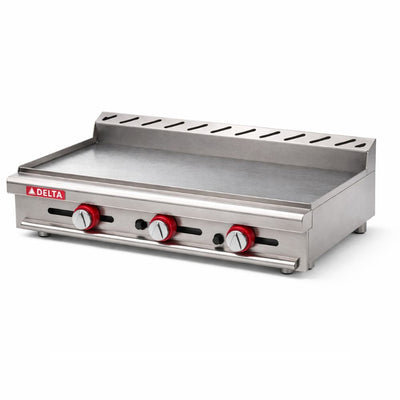Plancha Delta 3-G, en acero inoxidable.